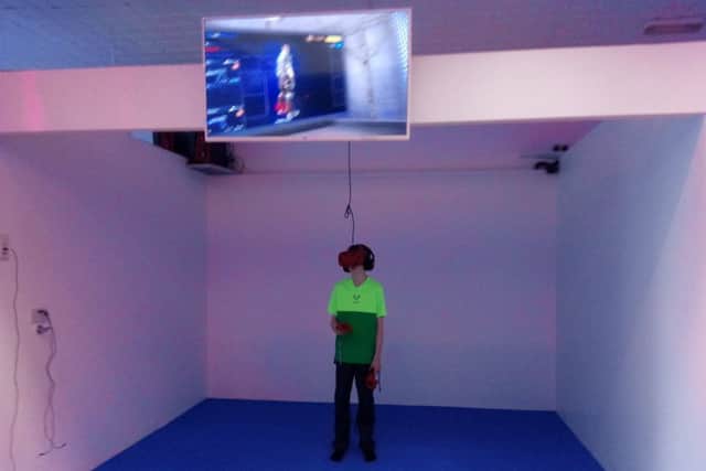 Casey Herron (13) playing one of the virtual reality games at Centrepoint